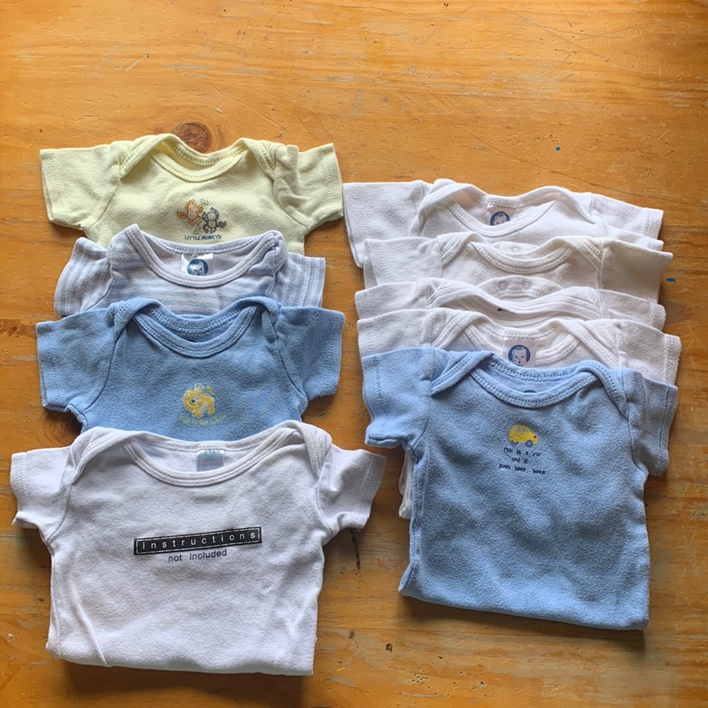 9 onesies- size 0-3 months.